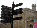 Signs in English and Welsh in front of Cardiff Castle. In Welsh, y and w are also vowels. Pronunciations of ch, dd, ll are unique to Welsh, and I still have a hard time memorizing place names.
