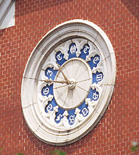 The front large clock with engraving of 11 Latin letters